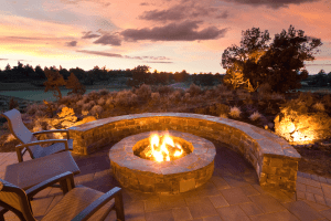 outdoor living patio with fire pit and seat wall | Sioux Falls, sd